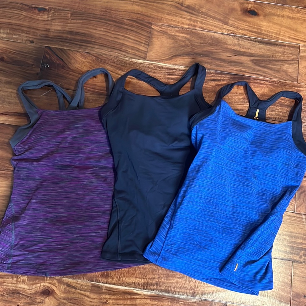 3 Athletic tops by Lucy. Women’s Medium